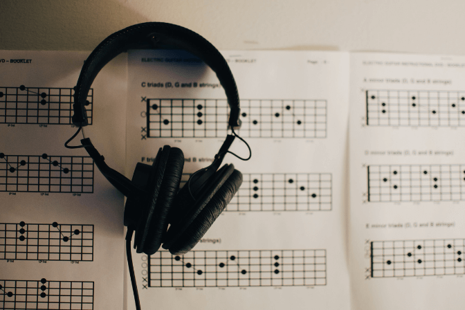 Headphone and paper music sheets