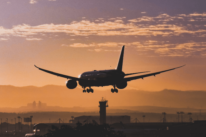 plane-flight-in-sunset