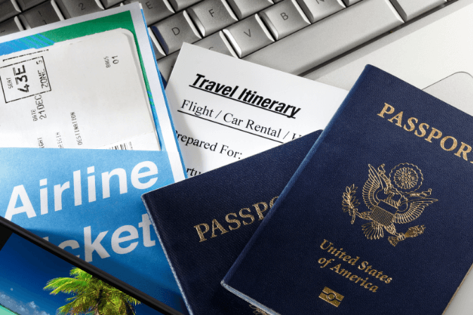 travel itinerary with passports and plane tickets