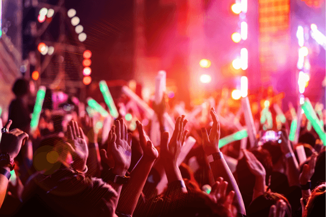 music festival with glow sticks at night