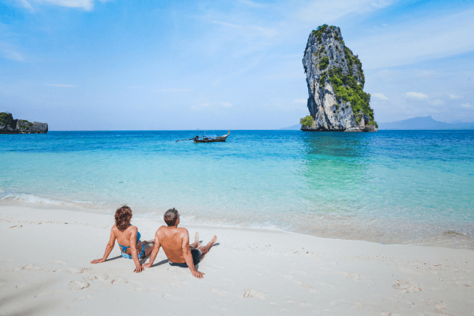 two people on a beach in thailand