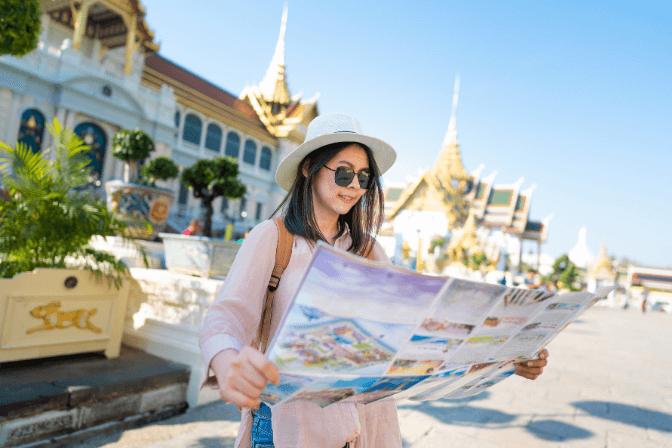 thai tourist looking at map