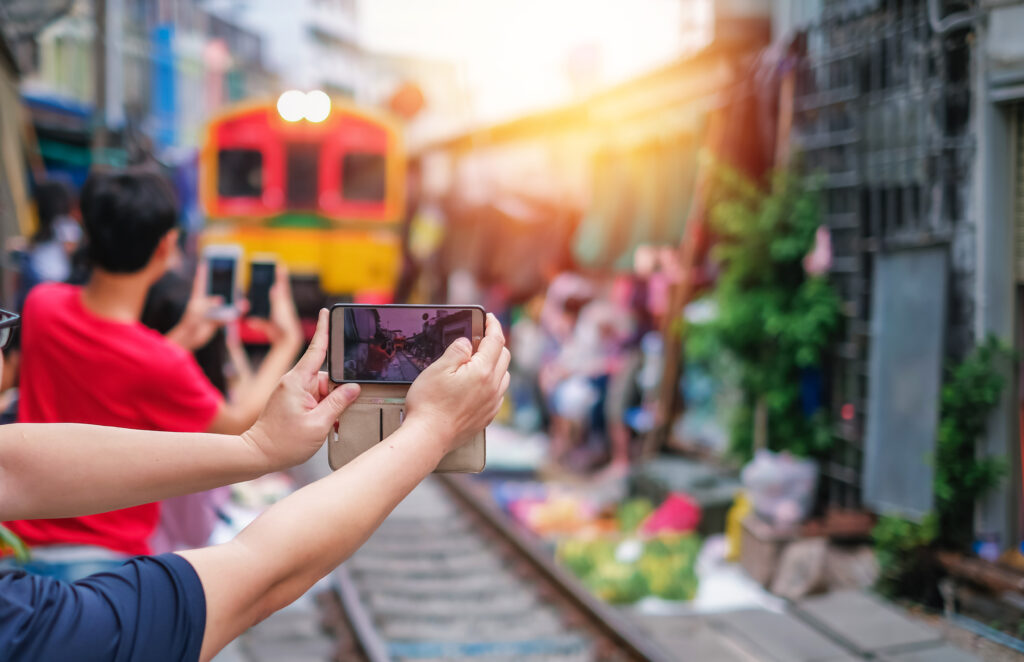 asia-tourists-taking-photo-train-coming-pass-fresh-market-by-amazing-vacation (1)