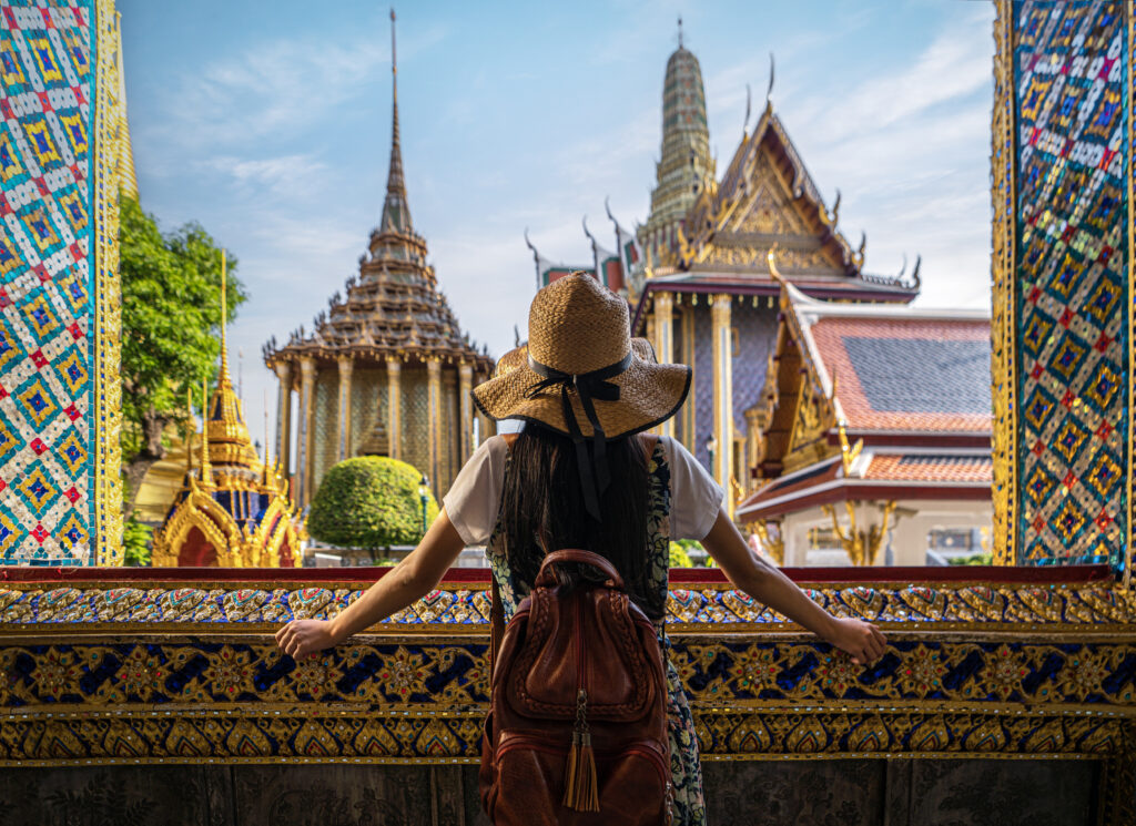 Asian woman traveller take a photo and travel in Bangkok grand palace and wat phra kaew in Bangkok city, Thailand